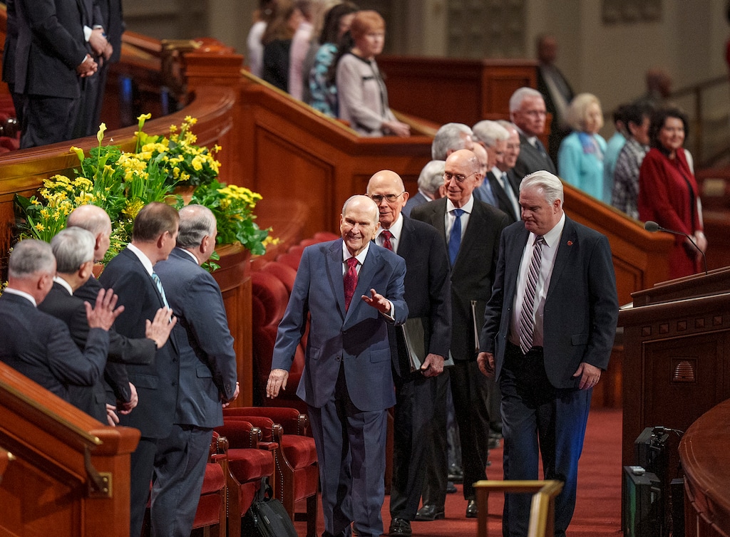 (Leah Hogsten | The Salt Lake Tribune) Members of the First Presidency of The Church of Jesus Christ of Latter-day Saints, center, Russell M. Nelson, waving, Dallin H. Oaks and Henry B. Eyring arrive for the spring General Conference Saturday, April 1, 2023.