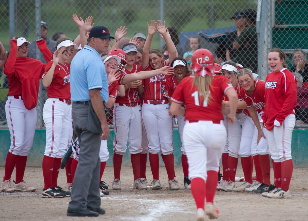 (Rick Egan  |  The Salt Lake Tribune)     Sophia Stoddard is greater by team mates after hitting a home run in game two for Bountiful, in 5A state championship action between the West High Panthers and the Bountiful Braves, in Taylorsville, Thursday May 30, 2019