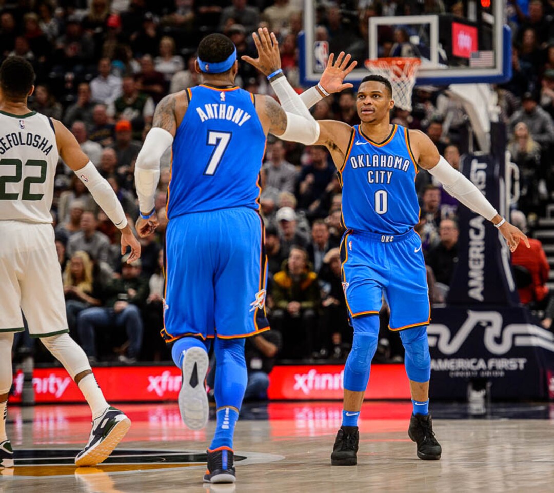 (Trent Nelson | The Salt Lake Tribune)  Oklahoma City Thunder guard Russell Westbrook (0) and Oklahoma City Thunder forward Carmelo Anthony (7) celebrate a Westbrook three-pointer and 13-point lead as the Utah Jazz host the Oklahoma City Thunder, NBA basketball in Salt Lake City, Saturday December 23, 2017.