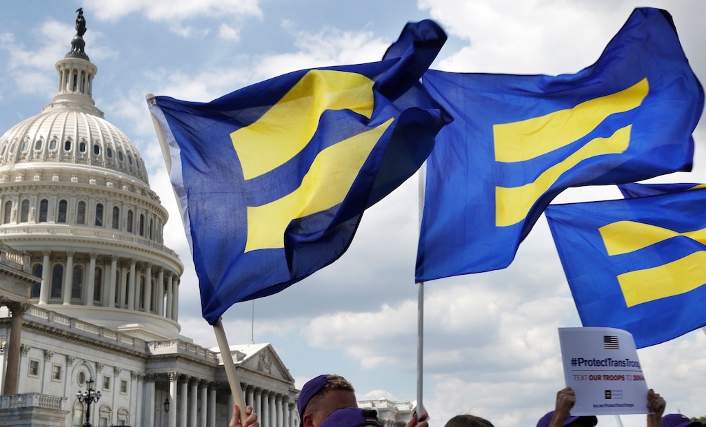 (Jacquelyn Martin | The Associated Press) People with the Human Rights Campaign hold up "equality flags" during an event organized by Rep. Joe Kennedy, D-Mass., in support of transgender members of the military, Wednesday, July 26, 2017, on Capitol Hill in Washington, after President Donald Trump said he wants transgender people barred from serving in the U.S. military "in any capacity," citing "tremendous medical costs and disruption." (AP Photo/Jacquelyn Martin)