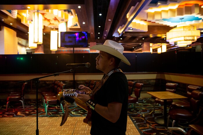 (Adriana Zehbrauskas | The New York Times) Travis Friday of Stateline goes through a sound check at the Northern Edge Casino in Farmington, N.M., Nov. 8, 2019. At highway honky-tonks, casino lounges and far-flung dance halls, a form of music that many associate with rural white America is flourishing in the heart of Indian country, and no tribe have put their own stamp on country music quite like the Navajo.