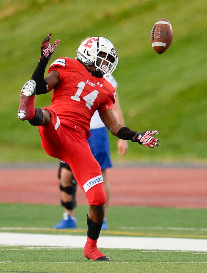 (Francisco Kjolseth  |  The Salt Lake Tribune)  Nick Session of East comes close to catching a pass intended for Bingham in the second quarter of their game at East on Friday, Aug. 24, 2018.