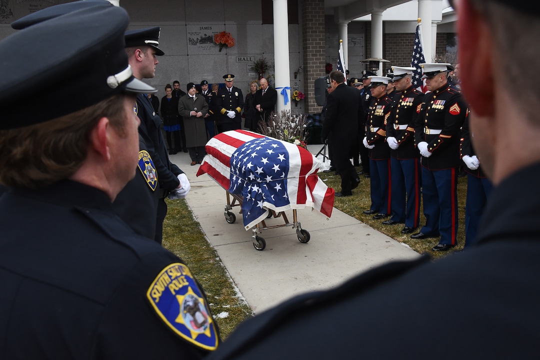 (Francisco Kjolseth  |  The Salt Lake Tribune)  Police officer David Romrell's funeral services take place at Larkin Sunset Gardens Cemetery in Sandy, Wed. Dec. 5, 2018.