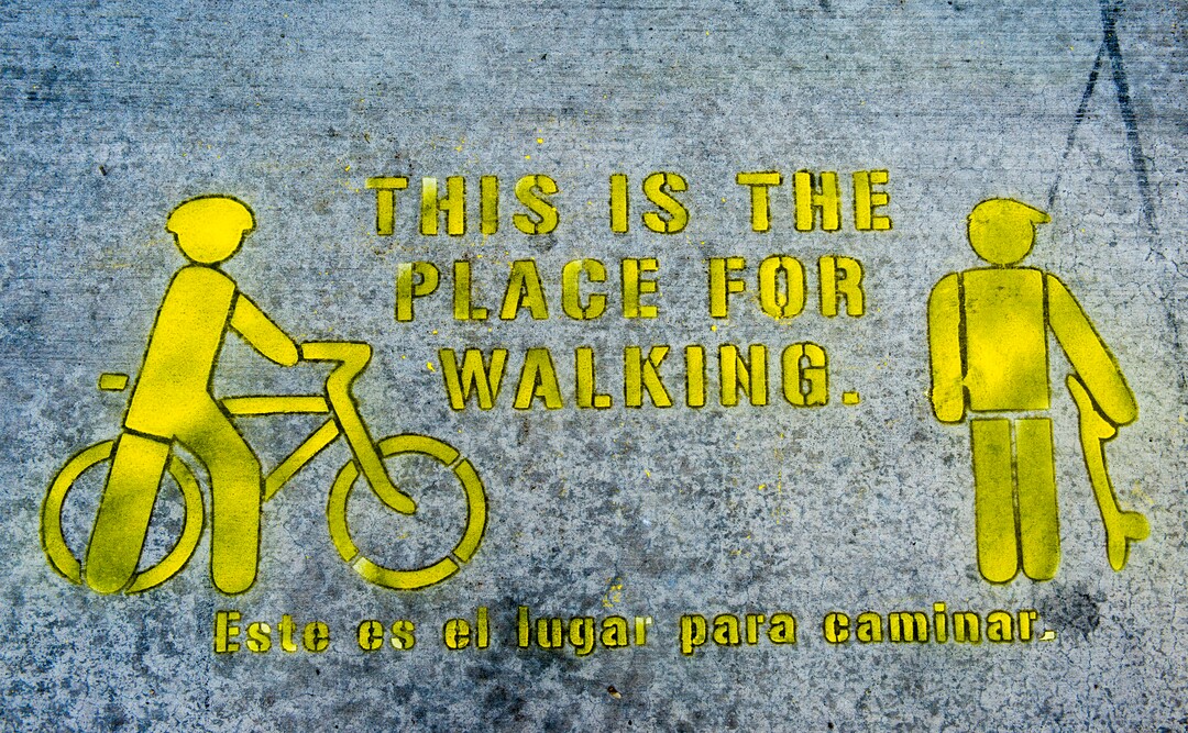 (Rick Egan  |  The Salt Lake Tribune)      A sidewalk stencil on 300 South, is part of a  a new campaign with the City of Salt Lake and e-scooter companies Lime and Bird in an effort to help residents and visitors understand the rules of the sidewalk, Wednesday, Oct. 3, 2018.