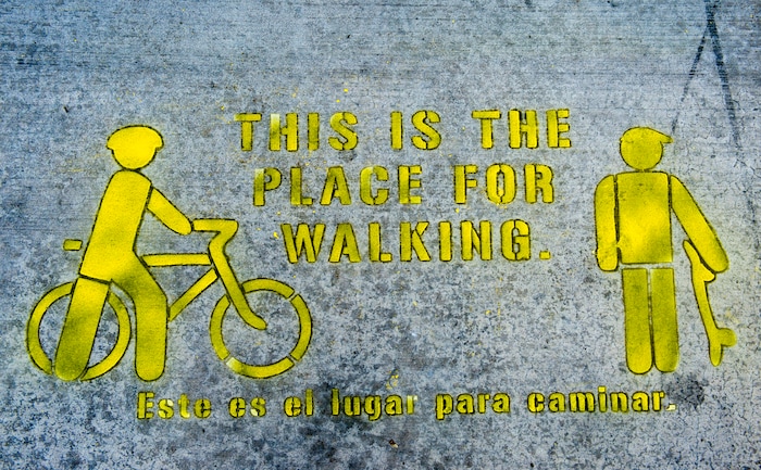 (Rick Egan  |  The Salt Lake Tribune)      A sidewalk stencil on 300 South, is part of a  a new campaign with the City of Salt Lake and e-scooter companies Lime and Bird in an effort to help residents and visitors understand the rules of the sidewalk, Wednesday, Oct. 3, 2018.


