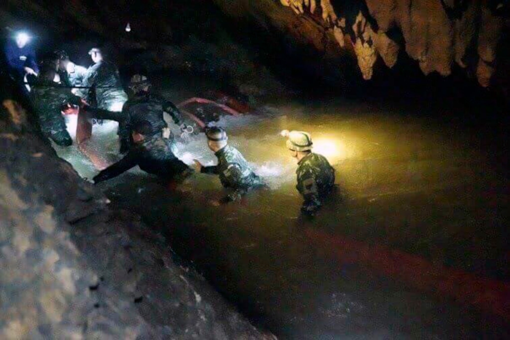 (Tham Luang Rescue Operation Center | The Associated Press) In this handout photo released by Tham Luang Rescue Operation Center, Thai rescue teams walk inside cave complex where 12 boys and their soccer coach went missing, in Mae Sai, Chiang Rai province, in northern Thailand, Monday, July 2, 2018. Rescue divers are advancing in the main passageway inside the flooded cave in northern Thailand where the boys and their coach have been missing more than a week.