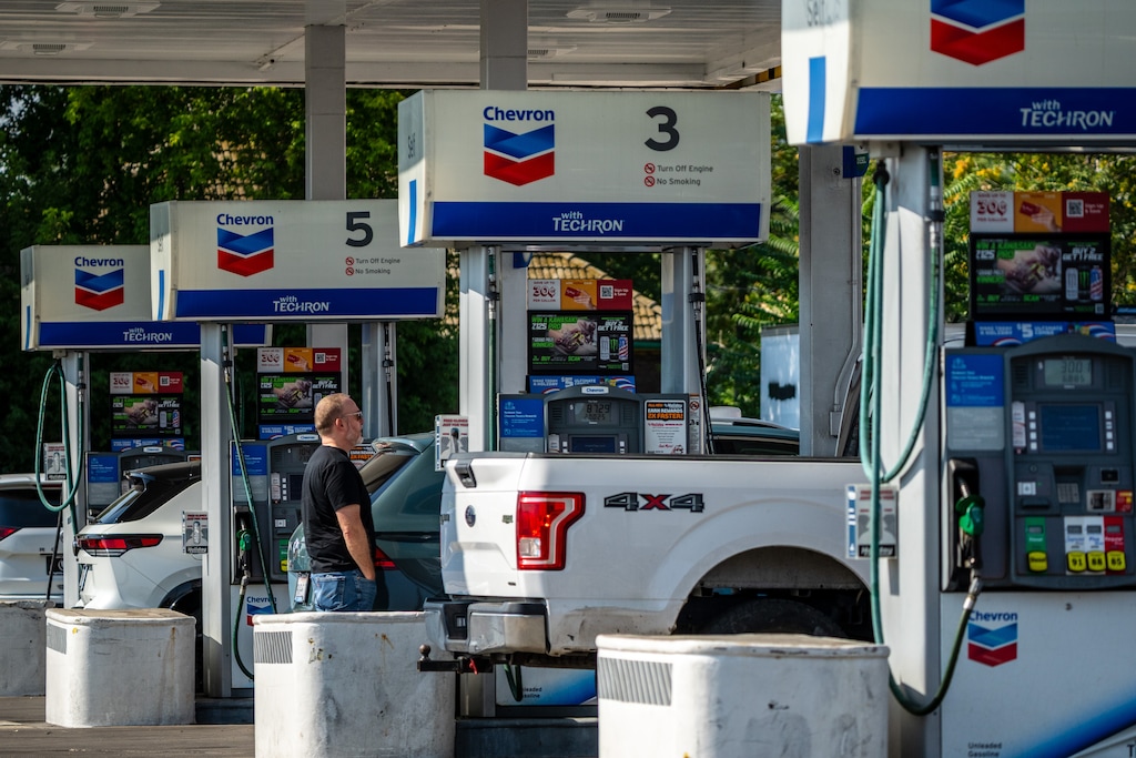 (Trent Nelson | The Salt Lake Tribune) People getting gas in South Salt Lake on Monday, Aug. 3, 2026.