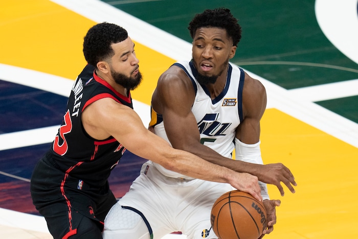 (Rick Egan | The Salt Lake Tribune) Toronto Raptors guard Fred VanVleet (23) is called for a foul as collides with Utah Jazz guard Donovan Mitchell (45), in NBA action between Utah Jazz and Toronto Raptors, at Vivint Arena, in Salt Lake City, on  Thursday, Nov. 18, 2021.