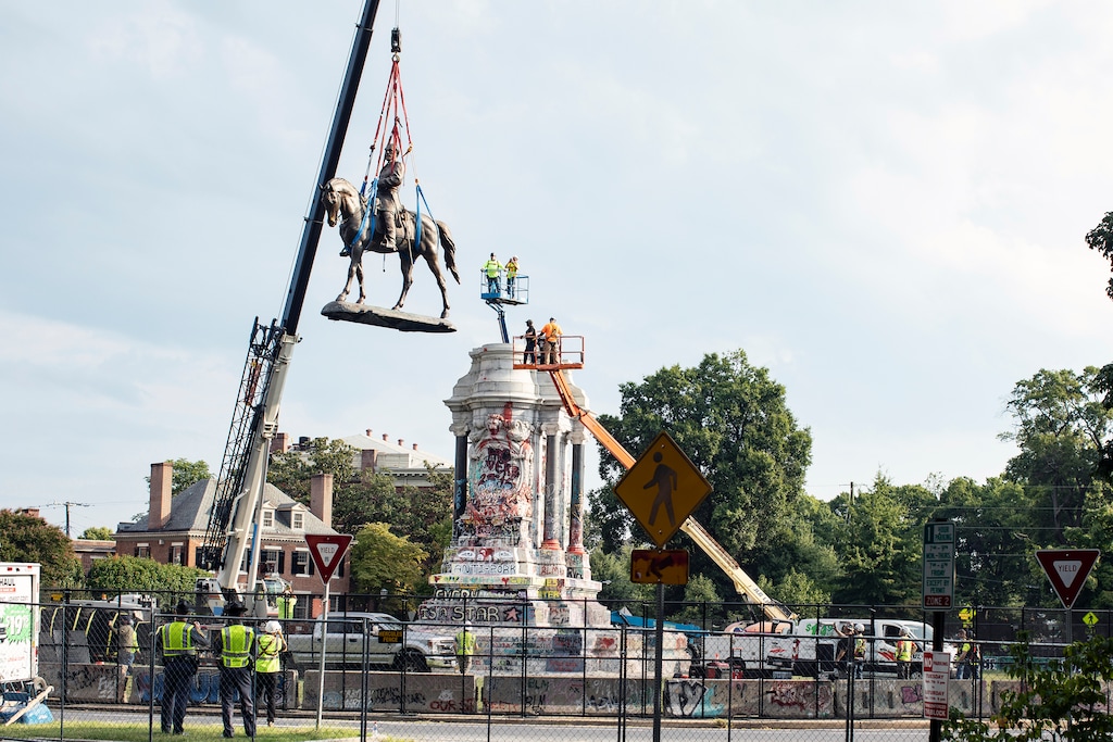 (Michael A. McCoy | The New York Times)

The statue of Robert E. Lee is removed from its pedestal in Richmond, Va., on Wednesday morning, Sept. 8, 2021. The Confederate memorial was erected in 1890, the first of six monuments that became symbols of white power along the main boulevard in Richmond.