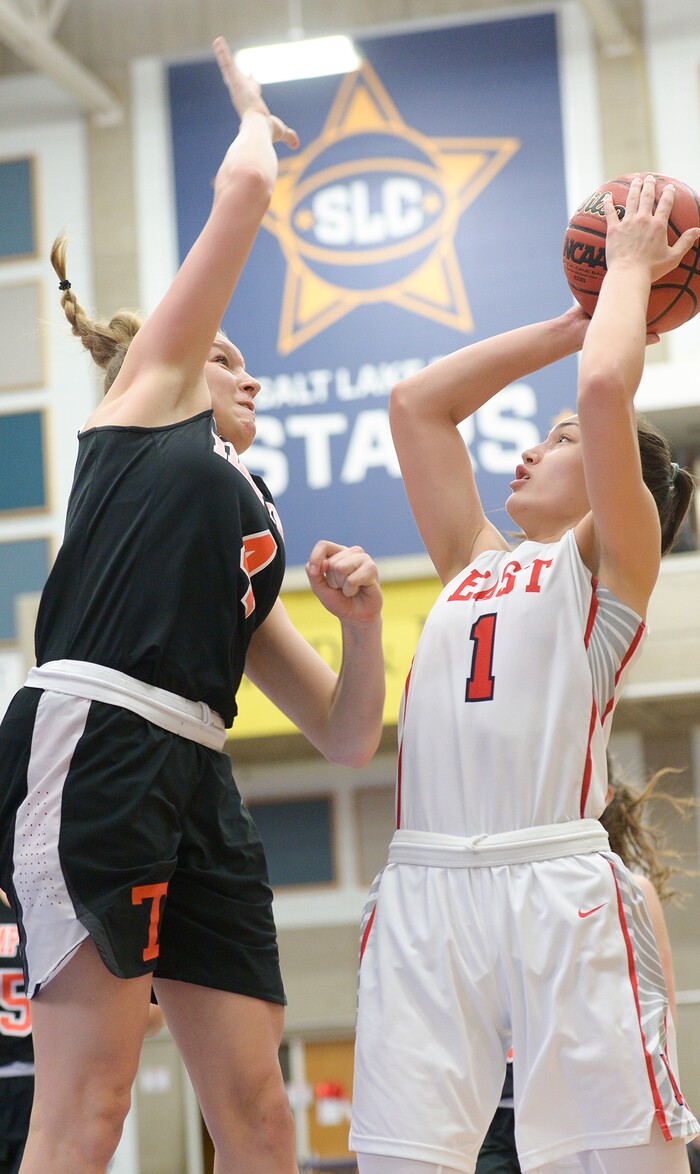 (Leah Hogsten  |  The Salt Lake Tribune)  Timpview's Ella Pope (04) fouls Desarae Falatea. East faces Timpview in the championship game of the 5A High School Girls' Basketball Tournament at SLCC in Taylorsville, Saturday, Feb. 24, 2018.