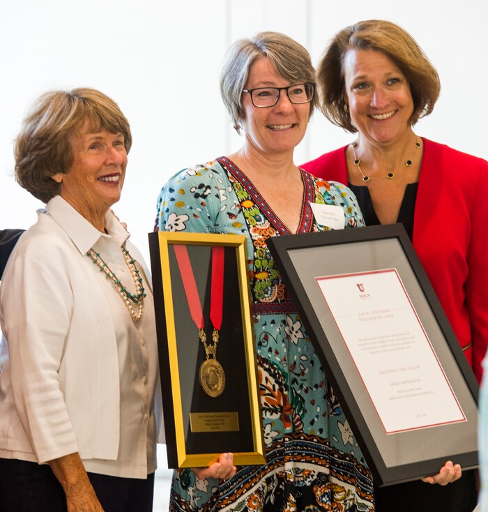 (Rick Egan  |  The Salt Lake Tribune)     Karen Huntsman and University of Utah President Ruth V. Watkins stand with Wendy Chapman as the University of Utah named Chapman and five other new Jon M. Huntsman Presidential Chairs, funded by the Huntsman Family Foundation, during a ceremony at the Alumni House, Tuesday, June 19, 2018.


