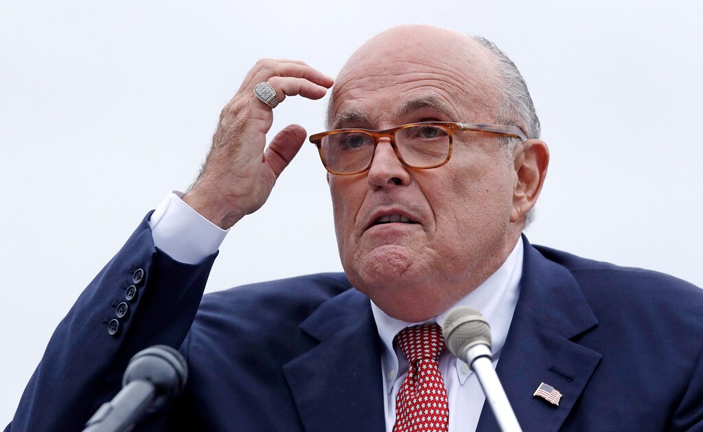 (AP Photo/Charles Krupa, File ) In this Aug. 1, 2018 file photo, Rudy Giuliani, an attorney for President Donald Trump, addresses a gathering during a campaign event fin Portsmouth, N.H. Giuliani says he’s never said there was no collusion between Russia and members of the Trump campaign. Giuliani’s comments Wednesday night on CNN directly contradict the position of his own client, who has repeatedly insisted that there was no collusion during his successful 2016 presidential campaign. Giuliani himself has described the idea of Russian collusion as “total fake news.”