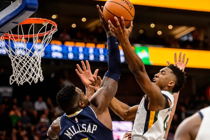 (Trent Nelson | The Salt Lake Tribune)  Utah Jazz guard Donovan Mitchell (45) shoots as the Utah Jazz host the Denver Nuggets, NBA basketball in Salt Lake City, Wednesday October 18, 2017.