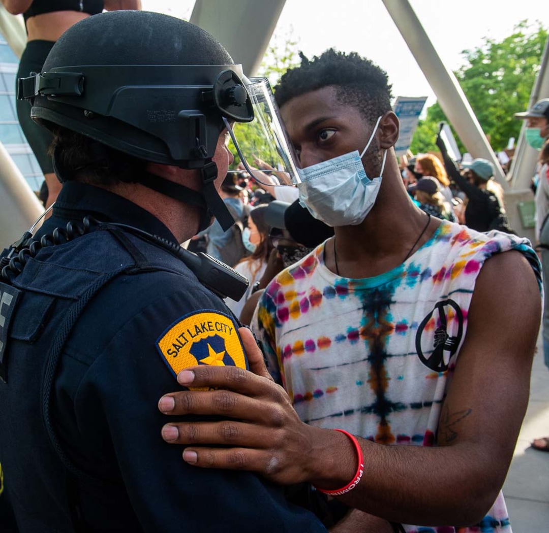 (Rick Egan | The Salt Lake Tribune) A protester hugs a Salt Lake City police officer during a peaceful protest for racial equality at the Salt Lake City police station on Monday, June 1, 2020.