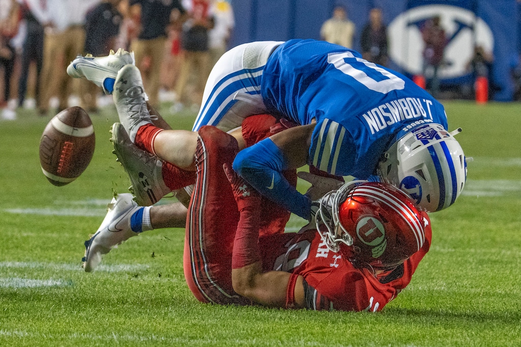 (Rick Egan | The Salt Lake Tribune) Brigham Young Cougars defensive back Jakob Robinson (0) breaks up a pass intended for Utah Utes wide receiver Britain Covey (18), in football action between the Utah Utes and the Brigham Young Cougars at Lavell Edwards Stadium in Provo, on Saturday, Sept. 11, 2021.