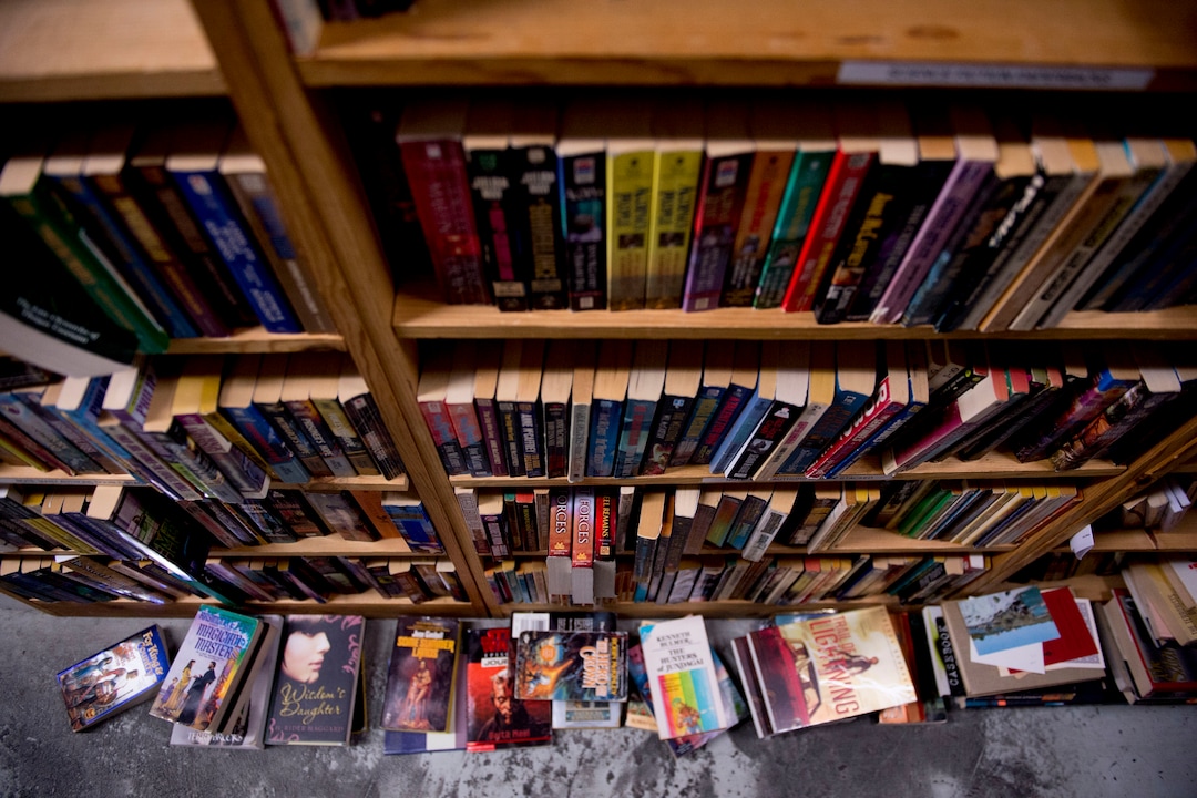 (Jeremy Harmon  |  The Salt Lake Tribune) Sci-fi books are stacked on the floor next to some shelves at Ken Sanders Rare Books in Salt Lake City on January 16, 2020.
