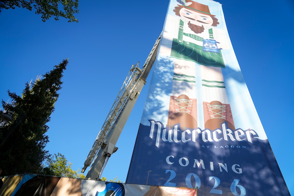 (Bethany Baker  |  The Salt Lake Tribune) A banner is hung from a crane during the unveiling of the new ride The Nutcracker at Lagoon Amusement Park in Farmington on Friday, Oct. 10, 2025.