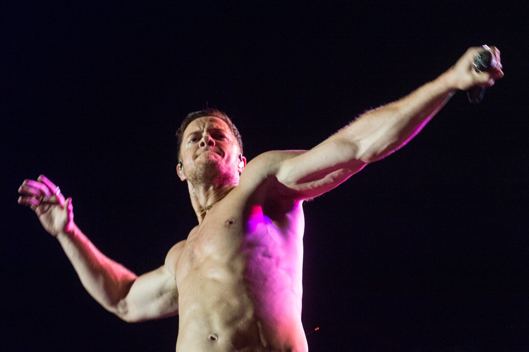 (Rick Egan  |  The Salt Lake Tribune)     Dan Reynolds performs with Imagine Dragons, at the Loveloud Festival at Rice-Eccles Stadium, Saturday, July 28, 2018.