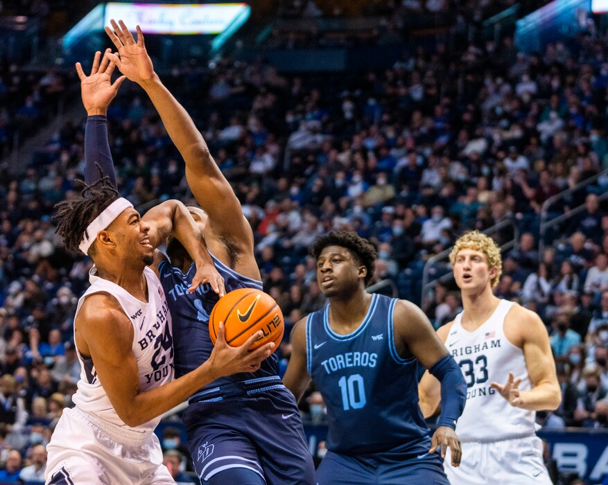 Rick Egan | The Salt Lake Tribune)  San Diego Toreros forward Josh Parrish (4) is called for a foul as he collides with Brigham Young Cougars forward Seneca Knight (24), in basketball action at the Marriott Center, on Thursday, January 20, 2022.