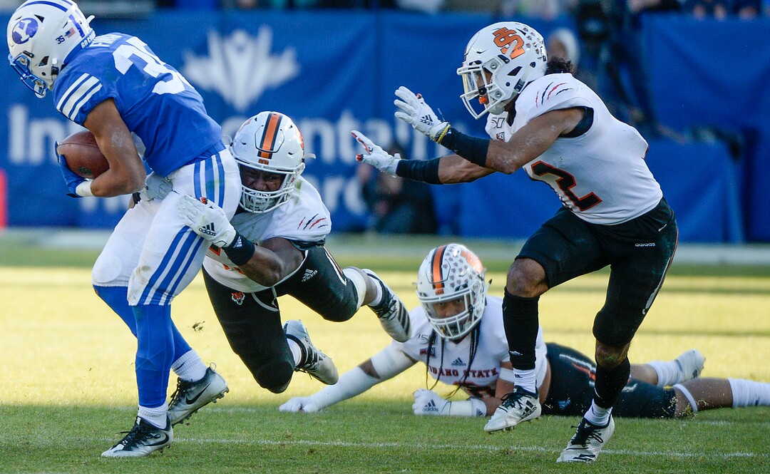 (Leah Hogsten  |  The Salt Lake Tribune) Idaho State Bengals linebacker Darian Green (52) tackles Brigham Young Cougars running back Sione Finau (35) as Brigham Young University takes on Idaho State, Saturday, Nov. 16, 2019 at LaVell Edwards Stadium.