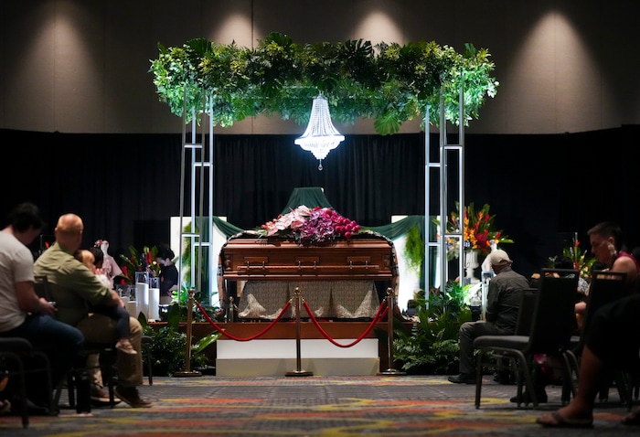 (Bethany Baker  |  The Salt Lake Tribune) The casket sits in the middle of the grand ballroom during the celebration of life for Afa Ah Loo, the man shot and killed during the 'No Kings' protest, during the community event at the Salt Palace Convention Center in Salt Lake City on Friday, June 27, 2025.