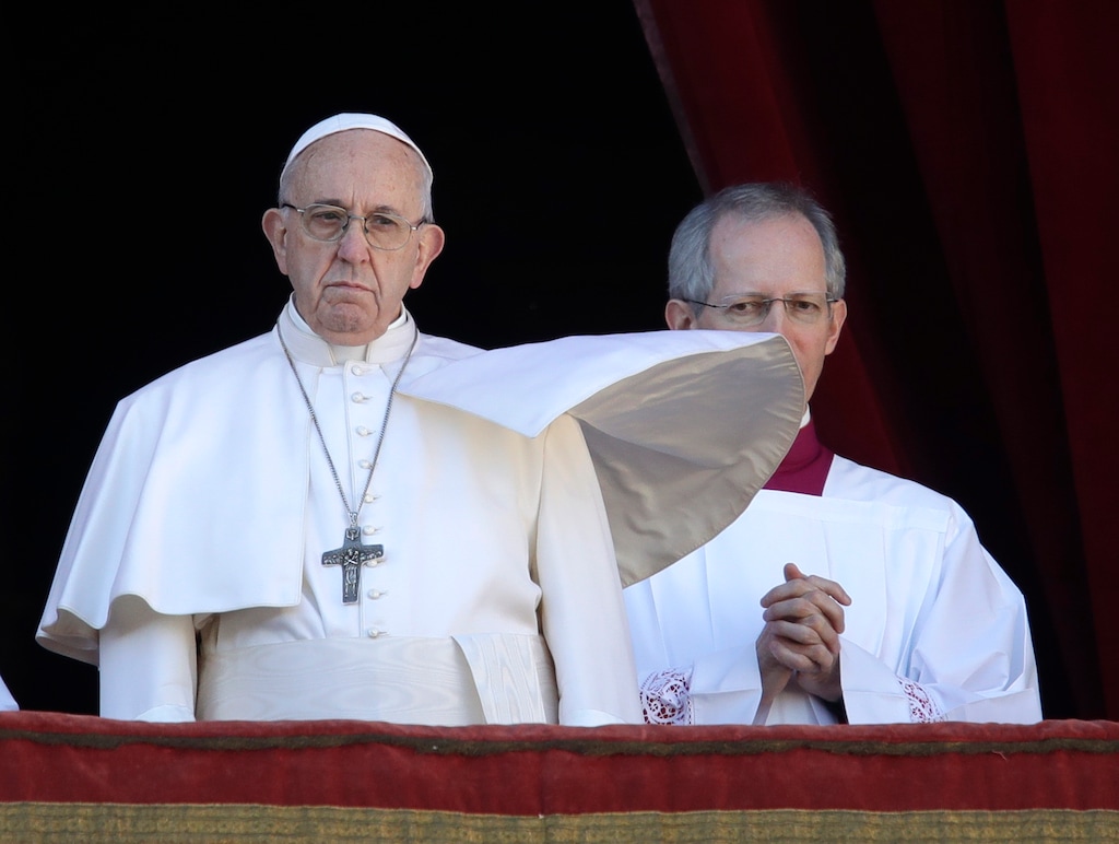 (AP Photo/Alessandra Tarantino) Pope Francis, flanked by Master of Ceremonies Bishop Guido Marini, looks at St. Peter's Square after the Urbi et Orbi (Latin for 'to the city and to the world' ) Christmas' blessing from the main balcony of St. Peter's Basilica at the Vatican, Tuesday, Dec. 25, 2018.