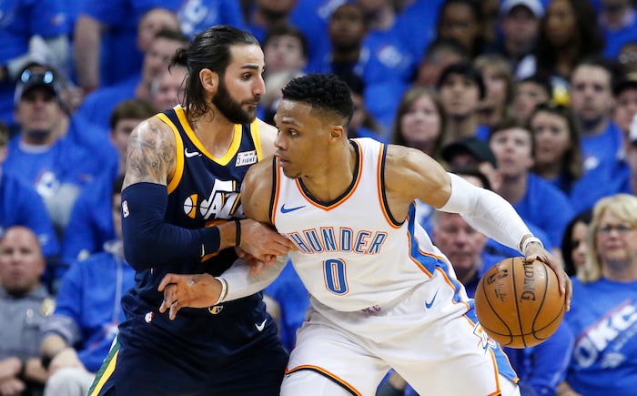 Oklahoma City Thunder guard Russell Westbrook (0) drives against Utah Jazz guard Ricky Rubio (3) in the second half of Game 1 of an NBA basketball first-round playoff series in Oklahoma City, Sunday, April 15, 2018. (AP Photo/Sue Ogrocki)