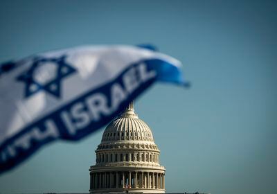(Haiyun Jiang | The New York Times) The U.S. Capitol in Washington, as protestors gather for a pro-Israel march on Nov. 14, 2023.