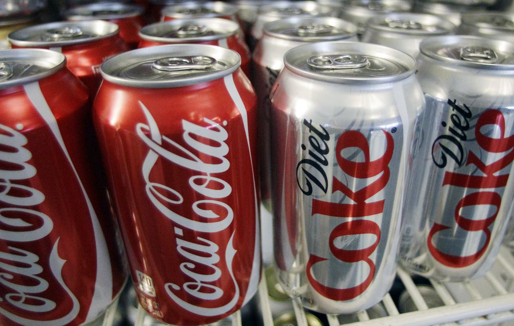 (AP) This 2011 photo shows cans of Coca-Cola and Diet Coke. Caffeinated drinks may not be particularly good for the body, but they drinking them doesn't violate the Latter-day Saints' Word of Wisdom.