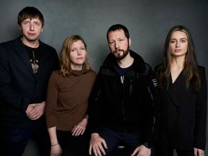 (Taylor Jewell | Invision/AP) Photographer Evgeniy Maloletka, from left, "Frontline" producer/editor Michelle Mizner, director Mstyslav Chernov, and field producer Vasilisa Stepanenko pose for a portrait to promote the film "20 Days in Mariupol" at the Latinx House during the Sundance Film Festival on Sunday, Jan. 22, 2023, in Park City.