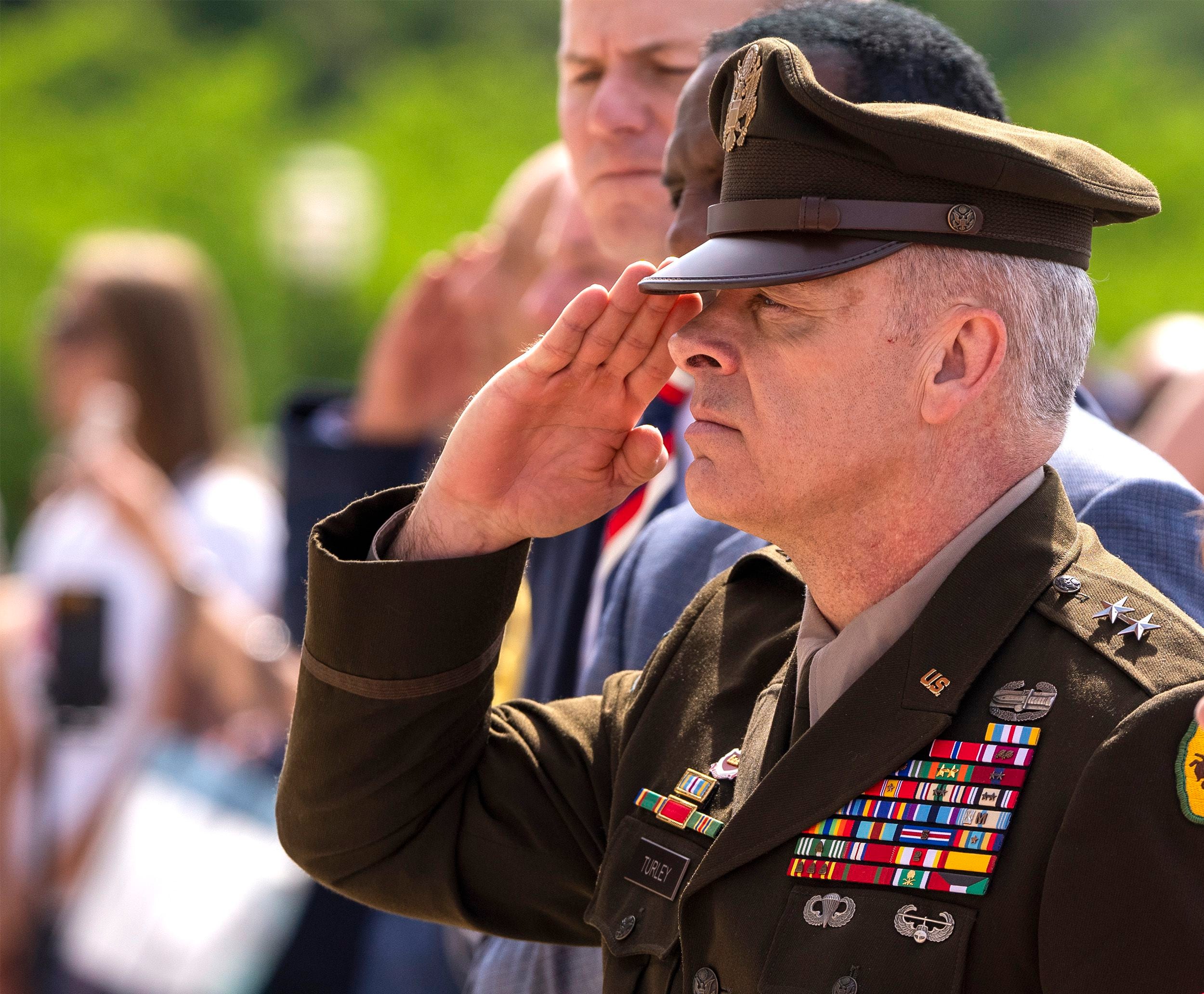 (Rick Egan | The Salt Lake Tribune) Maj. Gen. Michael Turley salutes as Taps is played at the Memorial Day Ceremony on the steps of the Utah Capitol Building on Monday, May 29, 2023.
