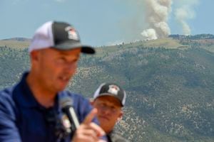 (Chris Samuels | The Salt Lake Tribune) Gov. Spencer Cox speaks in front of the Jacob City fire outside Stockton in Tooele County on Monday, July 11, 2022. Crews continue to battle several area wildfires that sparked over the hot, windy weekend — many of which officials believe were human-caused.