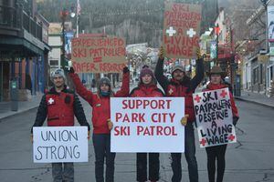 (Willie Maahs) The Park City Professional Ski Patrol Association has been pushing for a new contract with Vail Resorts since August 2020. In this courtesy photo, union members Tyler Grundstrom, Kate Foley, Lee Moriarty, Emmet Murray and Katie Woodward hold signs in Park City.