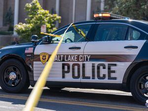 (SLCPD) A Salt Lake City Police Department patrol car at a crime scene in September. A Salt Lake City police officer was charged with sexual battery after he allegedly hit a woman on the butt with a boxing glove during a work training this summer.