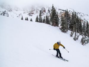 (Photo courtesy of Rocko Menzyk | Alta Ski Area) Earth Storm Jacobs of Salt Lake City celebrates New Year's Eve at Alta Ski Area on Dec. 31, 2020.