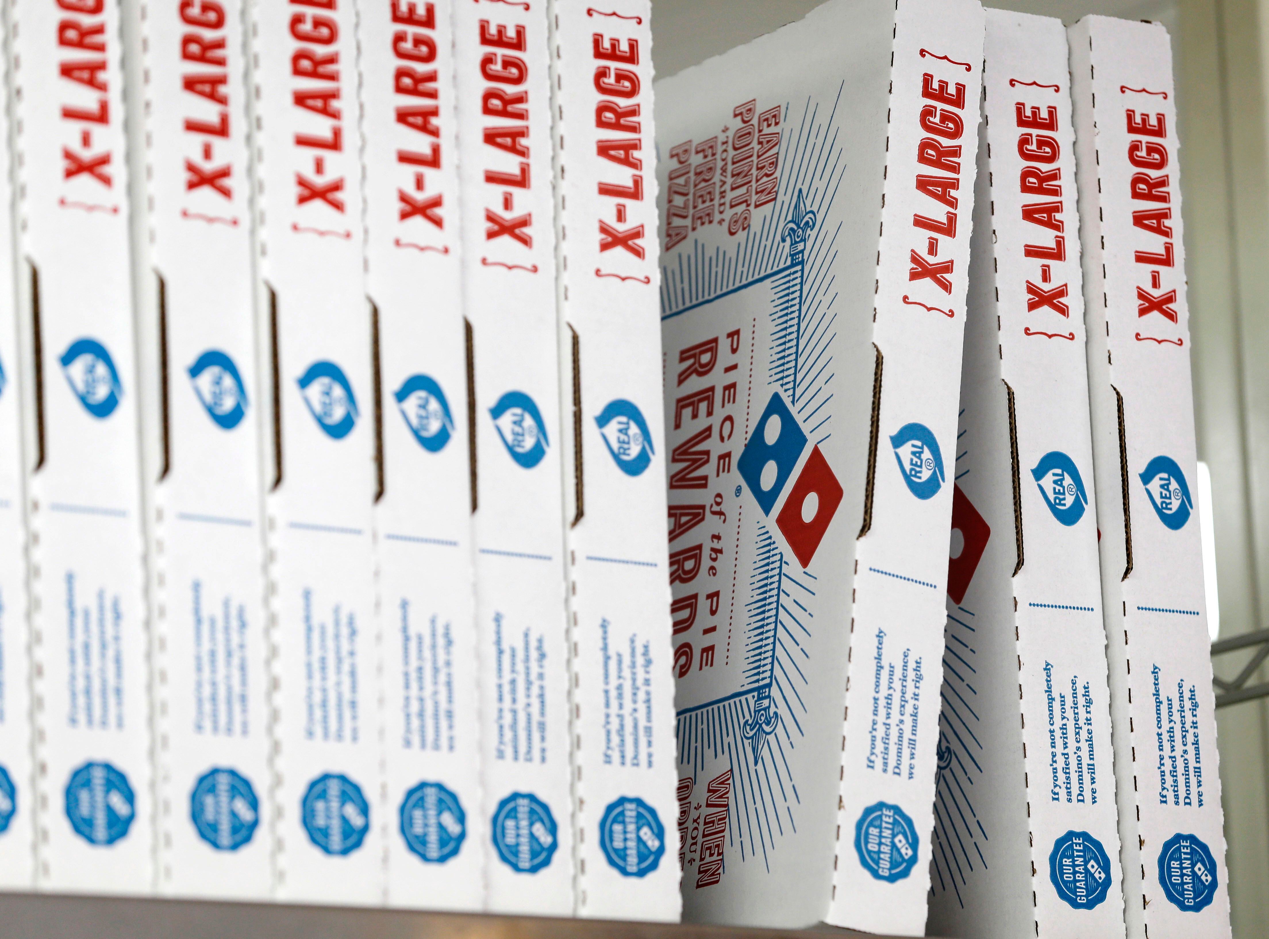 (Alan Diaz | AP) This 2016 photo shows Domino's Pizza boxes.