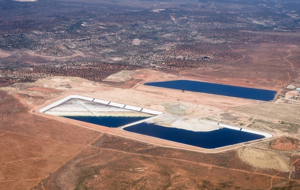 (EcoFlight) White Mesa Mill as recently as September 2021. Liquid is meant to cover waste from Superfund sites which can emit radon, a radioactive gas that can cause lung cancer. This aerial image shows a portion of the site left dry and uncovered.