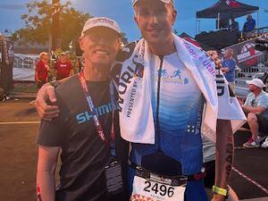 Colleen Brown/contributed
Kyle Brown of Kaysville, left, greets Patrick Harfield of the Caymen Islands at the finish line of the 2021 Ironman World Championships in St. George on Saturday, May 7, 2022. Brown, who has Lou Gehrig's Disease, and was pulled from the race after the swim convinced Harfield to finish the race after Harfield collapsed during the run.