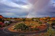 (Francisco Kjolseth  |  The Salt Lake Tribune) The late afternoon sun ignites a rainbow during a brief rain shower in the Devils Garden campground at Arches National Park May 19, 2013. A woman's body was found in this area over the weekend, authorities say.