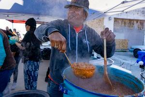 (Rick Egan | The Salt Lake Tribune) Dave John cooks up some beans for Navajo Tacos, as he teams up with Black Lives for Humanity volunteers to serve a "Gratitude Dinner" to more than 100 people from the unsheltered population, on 500 West in Salt Lake City, onThursday, Nov. 25, 2021.