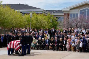 (Francisco Kjolseth | The Salt Lake Tribune) Family and friends of former U.S. Senator Orrin Hatch watch as final honors are performed by the Utah Army National Guard after the funeral at The Church of Jesus Christ of Latter-day Saints Institute of Religion in Salt Lake City on Friday, May 6, 2022. Hatch, the longest-serving Republican senator in U.S. history and the longest-serving from Utah, died April 23 at age 88.