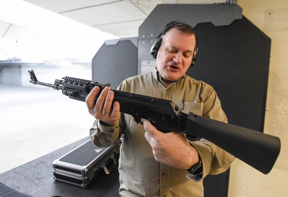 (Francisco Kjolseth | The Salt Lake Tribune) Utah gun rights advocate Clark Aposhian, one of only a handful of Americans who are legally allowed to keep their bump stock, a shooting accessory that alters semi-automatic rifles to fire in quick bursts like a machine gun, demonstrates how it works on an AKM-47 at a gun range in Murray, UT, on Thursday, April 4, 2019. He is challenging the bump stock ban in court, and an appeals court has allowed him to keep his bump stock until his case is resolved in court.