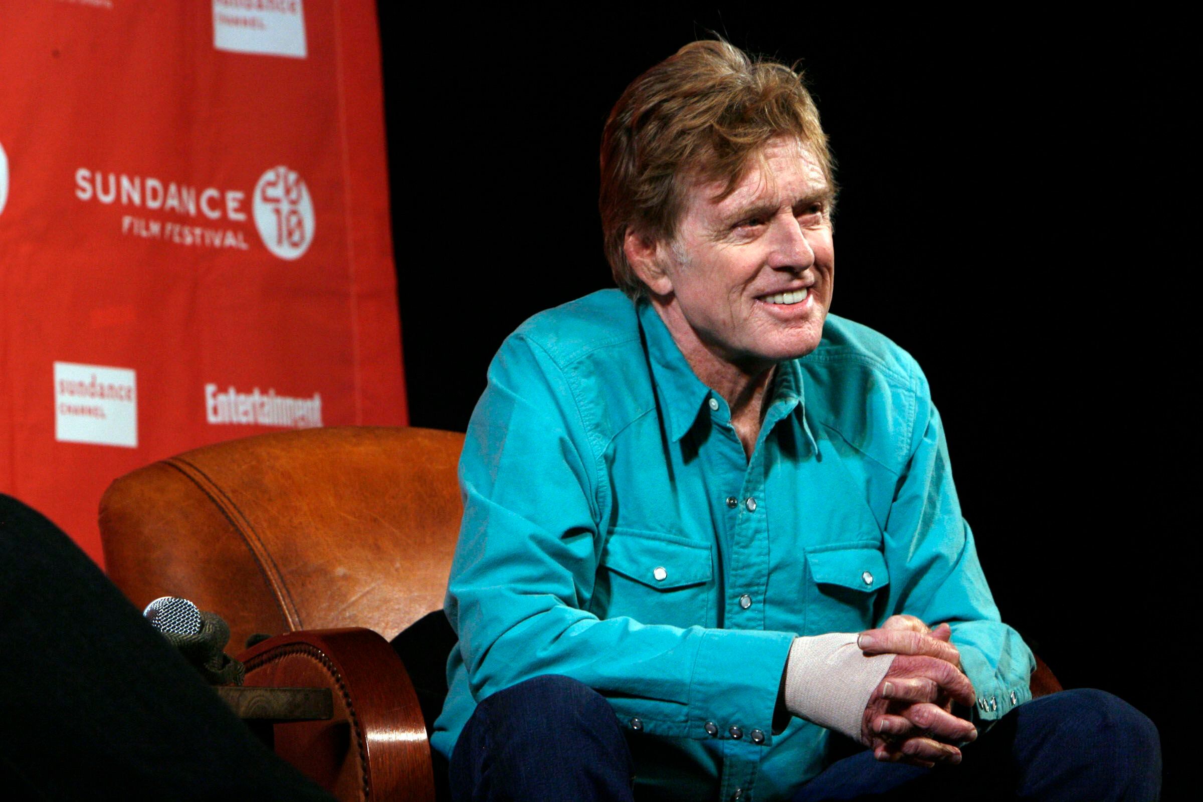 (Francisco Kjolseth  |  Salt Lake Tribune file photo) Robert Redford, seated alongside festival director John Cooper, answers questions from the media at the Egyptian Theatre as the Sundance Film Festival gets underway in Park City on Thursday, Jan. 21, 2010.