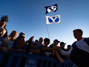 (Francisco Kjolseth | The Salt Lake Tribune) Cougar fans cheer on their team as they arrive at LaVell Edwards Stadium in Provo, Saturday, Sept. 25, 2021, for their game against South Florida.