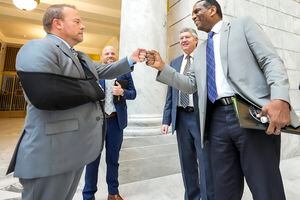 (Leah Hogsten | The Salt Lake Tribune)  U.S. Rep. Burgess Owens fist bumps lobbyist Jeff Hartley at the Capitol Tuesday, Jan. 25, 2022. Owens also met with House and Senate Republicans and Gov. Spencer Cox during the Legislative session.