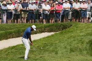 Tony Finau hits on the 18th hole during the second round of the U.S. Open golf tournament at The Country Club, Friday, June 17, 2022, in Brookline, Mass. (AP Photo/Charlie Riedel)