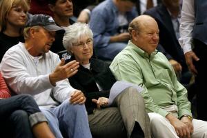 (Al Hartmann  |  Tribune file photo) Larry and Gail Miller watch a game with Gordon Monson in 2007.